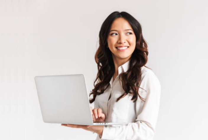Professional woman with laptop in white shirt